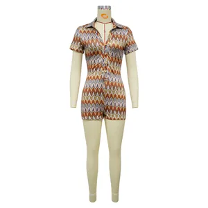 Front view of a colorful zigzag pattern romper with V-neck and short sleeves on a mannequin