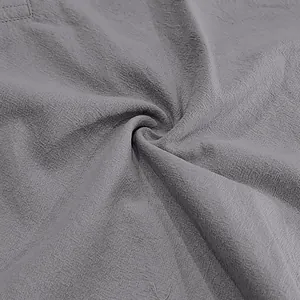 Close-up macro detail showing the breathable texture of grey linen cotton fabric
