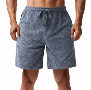 Detailed view of men's tie-dye French Terry shorts with elastic drawstring waist