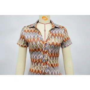 Detail view of women's short sleeve romper with zigzag chevron pattern and V-neck