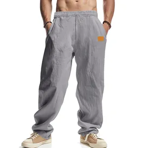 Men's loose fit grey linen casual pants with breathable fabric and drawstring waist.