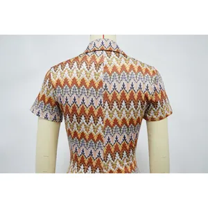 Back view of women's zigzag pattern romper with short sleeves and vibrant colors