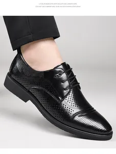 Macro view of black perforated leather Derby shoe showing elegant design and texture