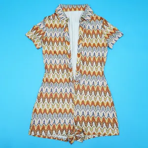 Women's fashion romper with colorful zigzag chevron pattern and V-neck short sleeve design.