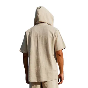 Detailed back view of men's loose summer linen hooded Henley short sleeve shirt in sand
