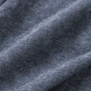 Close-up of grey French terry fabric with acid wash texture for men's shorts.