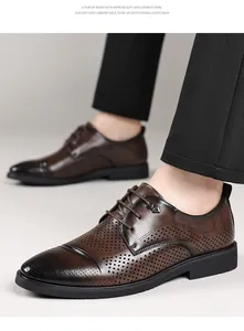 Detailed shot of brown perforated leather Derby shoes for men's business formal wear.