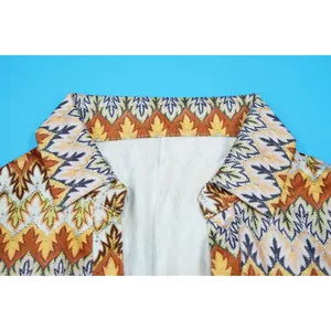 Close-up of the stylish V-neck collar with colorful wave pattern for women's romper