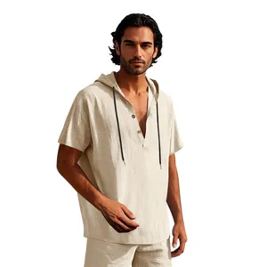 Detailed view of a men's beige linen hooded Henley short sleeve shirt for summer beach.
