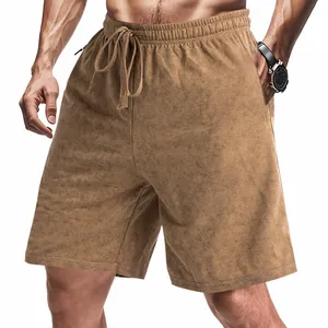 Detail view of men's brown tie-dye loose-fit casual shorts with drawstring waist.
