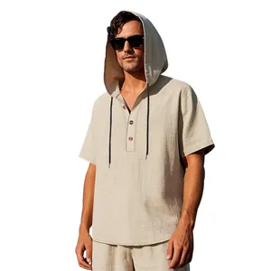 Detail view of a men's beige linen hooded Henley shirt with buttons and drawstrings.