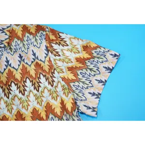 Close-up detail of the wave pattern fabric on a women's short sleeve fashion romper