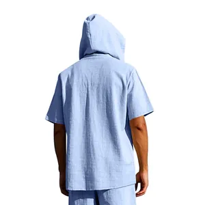 Detailed back view of a men's light blue summer linen short sleeve hooded beach shirt