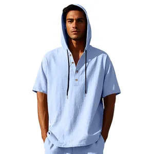 Detail view of men's blue linen hooded Henley shirt with buttons and drawstrings