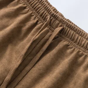 Detailed view of the comfortable elastic waistband and drawstring on tie-dye shorts