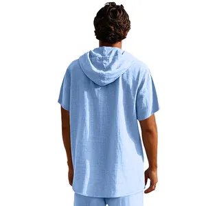 Back view of a light blue short-sleeved linen hooded Henley shirt for men in casual summer style.