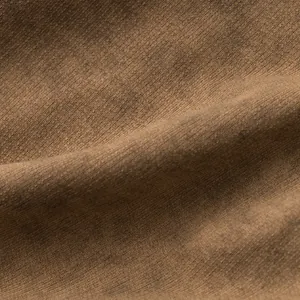 Detailed close-up macro view showing premium brown tie-dye terry cloth fabric texture.