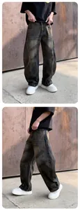 Vue détaillée d'un jean large délavé pour homme avec finition gris foncé vintage