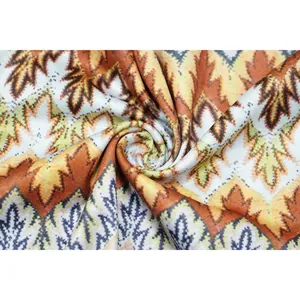 Detailed macro shot of soft fabric with autumn maple leaf prints and wavy stripes