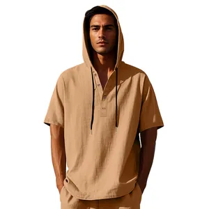 Detailed view of a men's loose linen hooded Henley short sleeve shirt in tan color