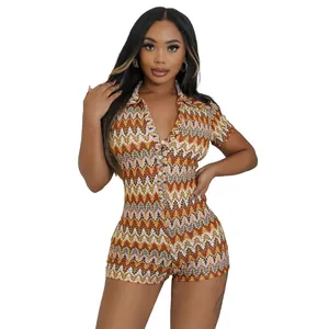 Macro detail showing the vibrant zigzag wave pattern on a women's short-sleeve V-neck romper.