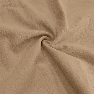 Macro shot of breathable khaki linen fabric texture for summer men's beachwear.