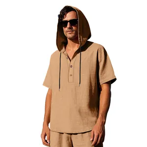 Close-up detail of a men's tan linen hooded Henley shirt with a button-up placket.