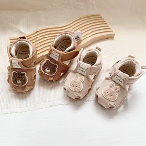 Detail shot of Morino cartoon baby sandals with bear and rabbit embroidery