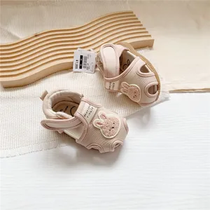 Detailed view of morino baby squeaky sandals featuring a cute bunny patch and brand tag