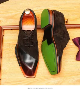 Macro view of suede and polished leather Oxford shoes featuring a vibrant green sole