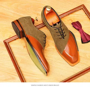 Close-up detail of retro suede and shiny patent leather patchwork men's oxford shoes