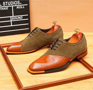 Detailed side view of retro suede and polished leather patchwork oxfords on wood