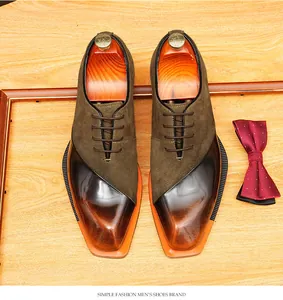 Detailed view of vintage men's patchwork leather and suede oxford shoes with lace-up design.