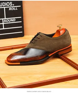 Detailed macro view of men's burnished leather and suede Oxford shoes with orange welt detail.