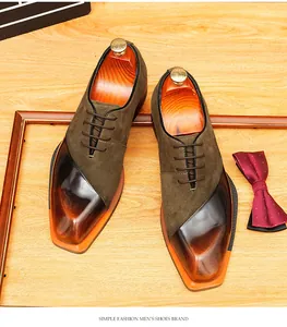 Detailed view of vintage men's Oxford shoes with suede and shiny leather splicing