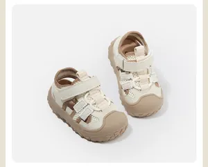 Close-up of beige mesh toddler sandals with anti-collision toe and velcro strap