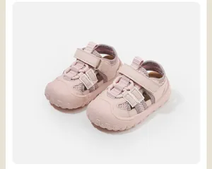 Detail of pink anti-collision baby walking sandals with mesh and Velcro strap