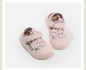 Detailed view of pink toddler closed-toe sandals featuring mesh panels and secure Velcro straps