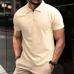Detail of a men's cream knit polo shirt featuring a modern half-zipper collar