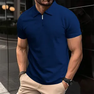 Close-up of men's navy blue knit polo shirt featuring a sleek half-zip collar