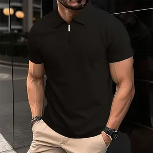 Close-up of a men's black knit polo shirt featuring a modern half-zip collar design