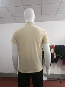 Back view of a breathable beige short-sleeved knit polo shirt on a white mannequin
