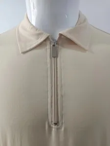 Detail shot of men's knit polo shirt with high-quality silver half-zip closure
