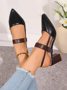 Detail view of stylish pointed-toe chunky heel pumps with brown ankle straps for women