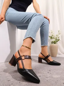 Elegant detail shot of women's pointed toe block heel pumps with a stylish gold buckle accent