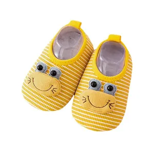 Yellow striped baby indoor shoes with cute frog face design and soft anti-slip rubber soles.