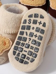 Close-up of anti-slip baby floor sock sole with cute calculator math symbols