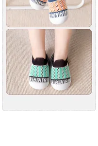 Close-up of breathable mesh baby walker shoes with protective white rubber toes.