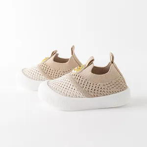 Breathable beige fly-knit baby walking shoes with soft non-slip soles for infants