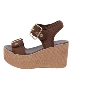 Stylish brown platform wedge sandals with braided jute soles and gold metal buckles